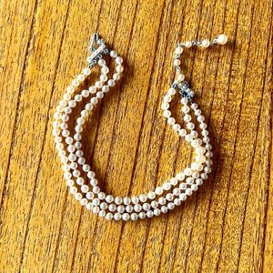 Triple strand faux pearl necklace